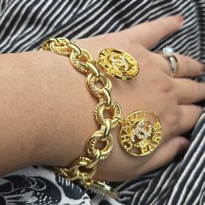 Chanel buttons on dubai gold Chain  upcycled and stamped chanel charms bracelet